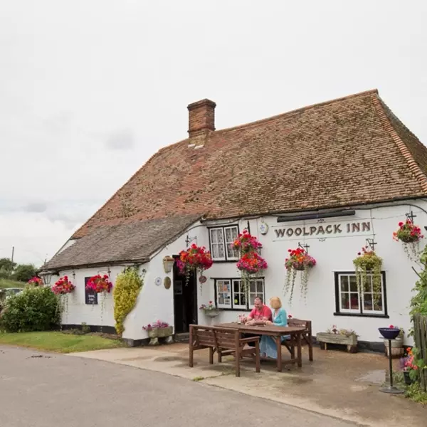 The Woolpack Inn, Romney Marsh exterior with couple outside